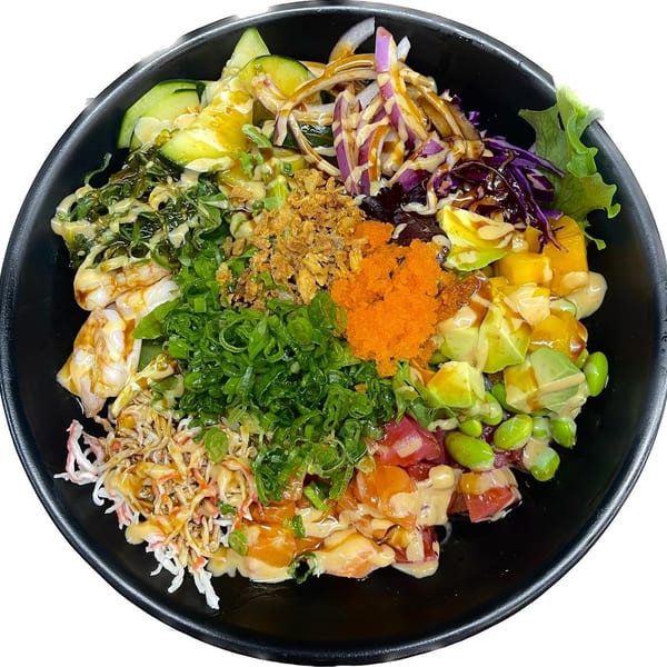A vibrant Madden Ramen poke bowl with various toppings, including seafood, vegetables, and sauces.